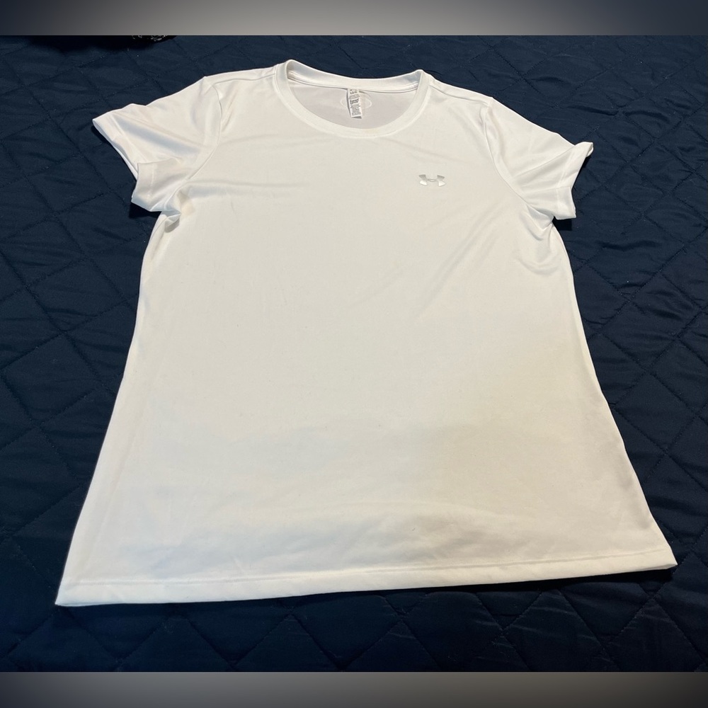 Woman’s white Under Armour Heat Gear, rounded neck t-shirt.